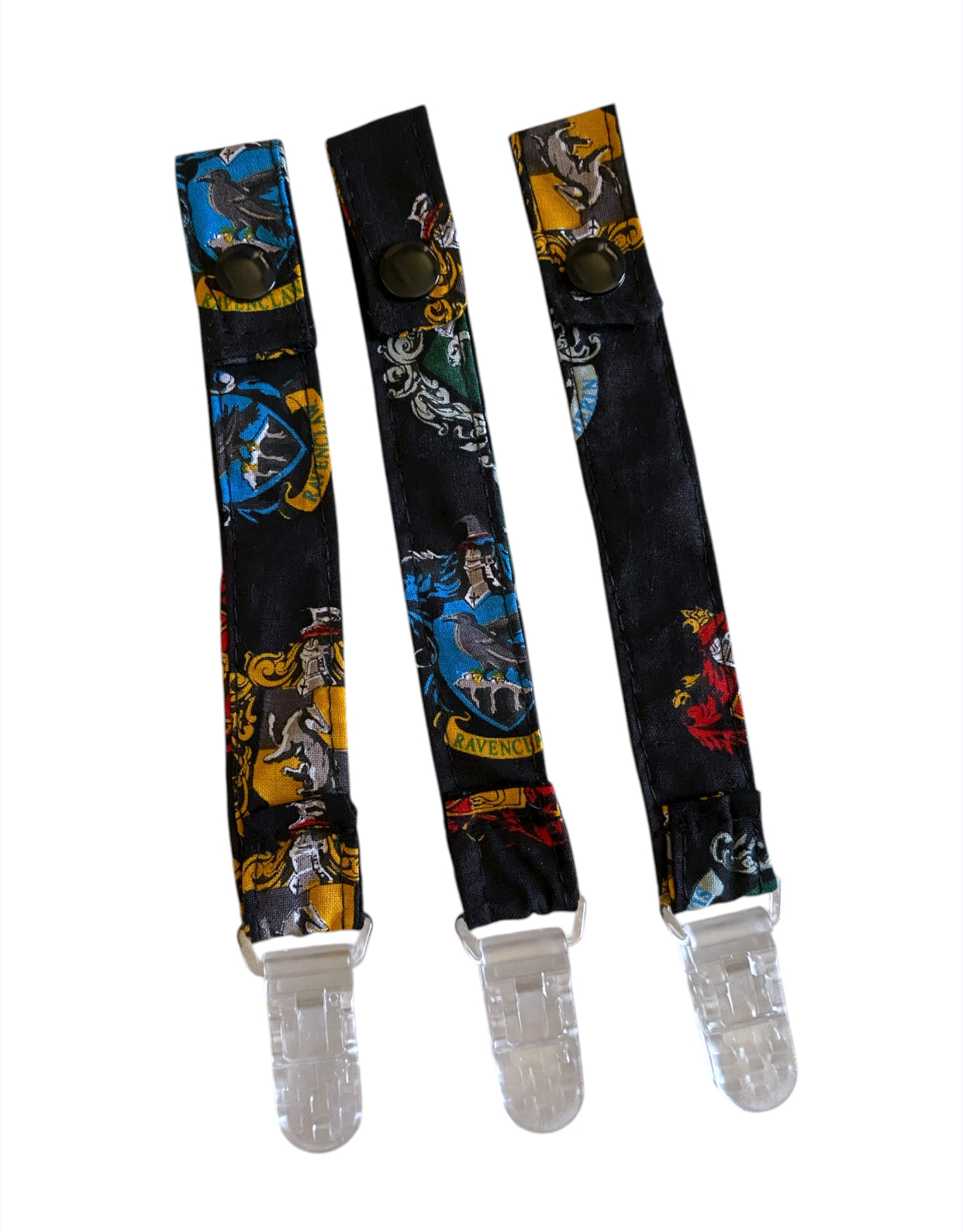 Three dummy strap with Harry Potter design on a white background