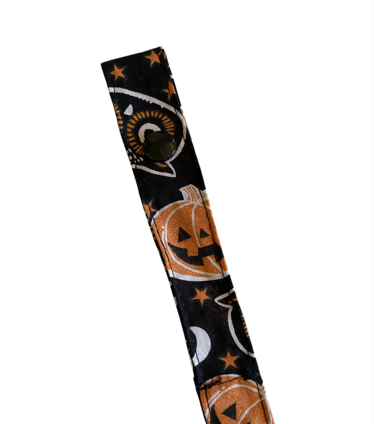 Halloween-themed product with pumpkins, ghosts, and stars on a black background