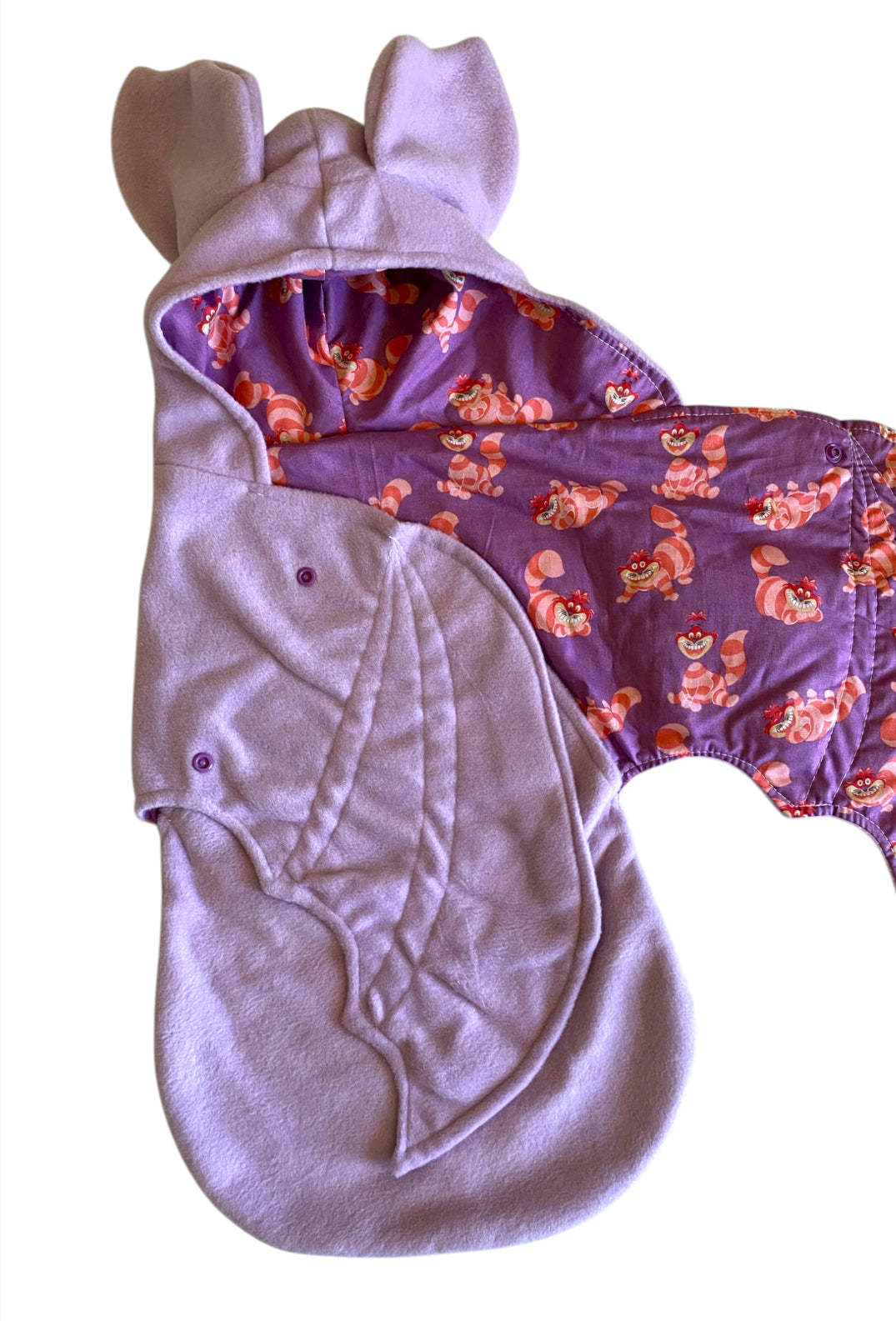 Baby outfit with hood and purple body featuring cartoon character design on a white background