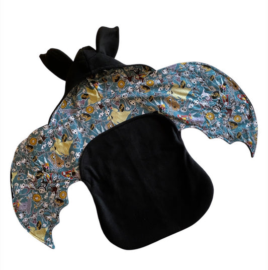 Colorful bat ear swaddle with black base on a white background