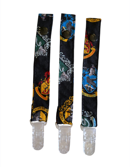 Three pacifier strap with Harry Potter designs on a white background