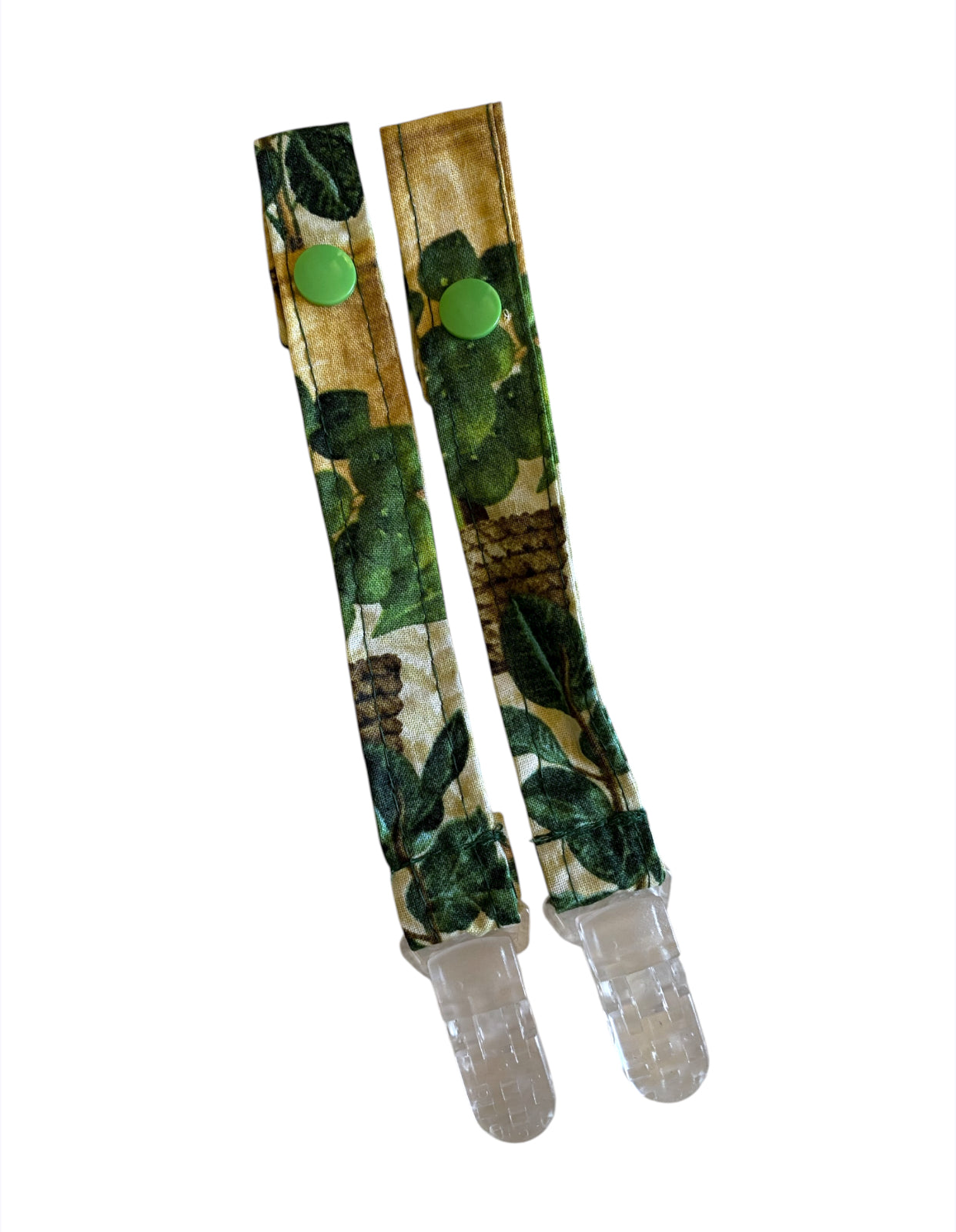 Pair of green camouflage baby bottle straps on a white background