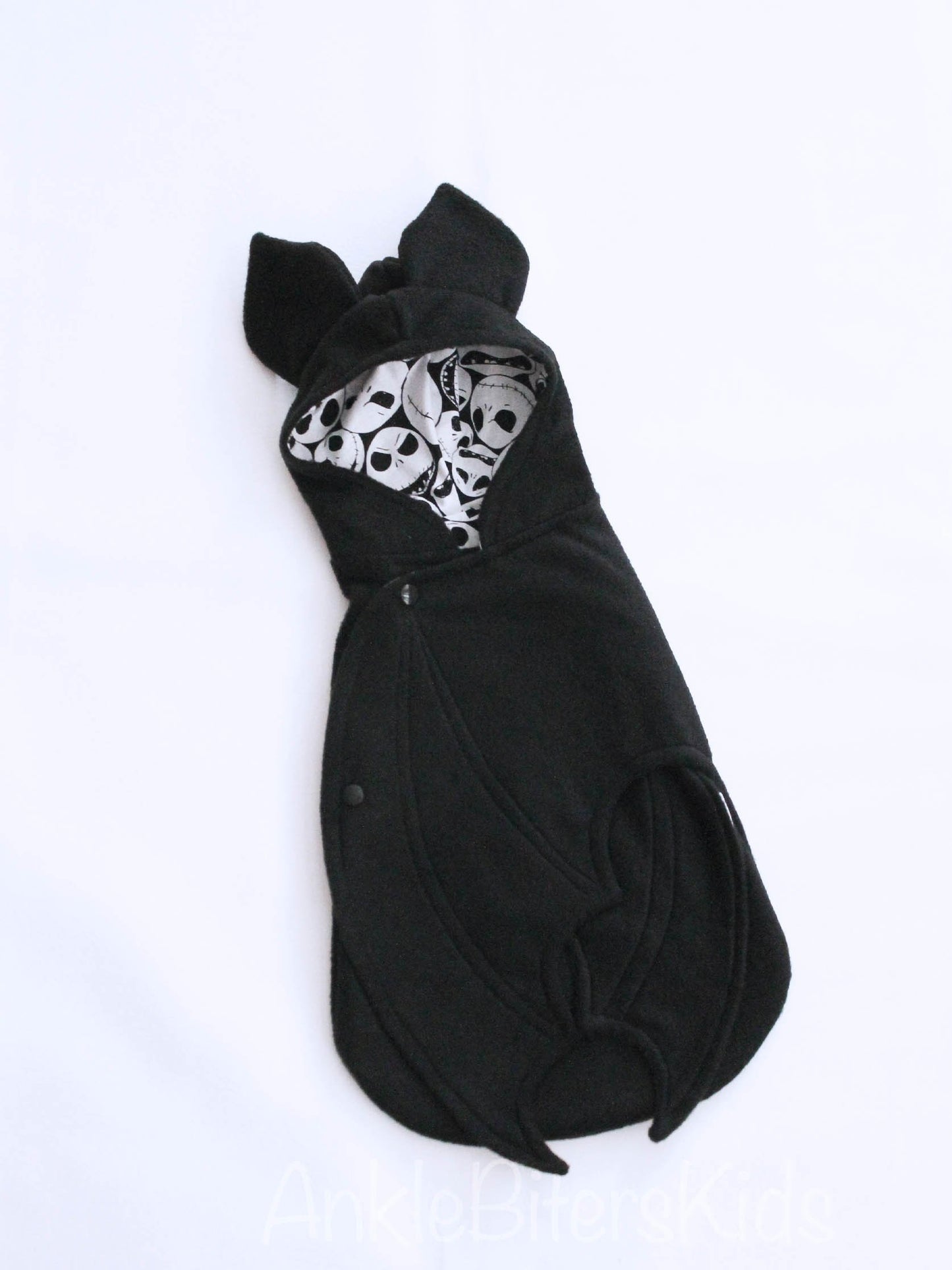 Black baby swaddle with skull pattern on a white background