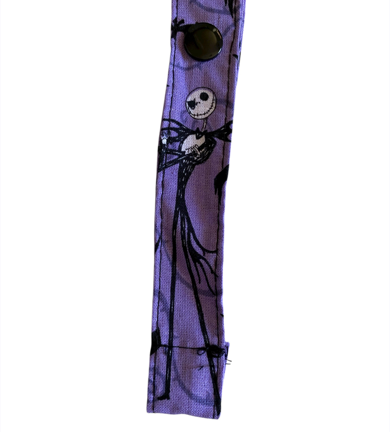 Purple strap with black skeleton design on a white background