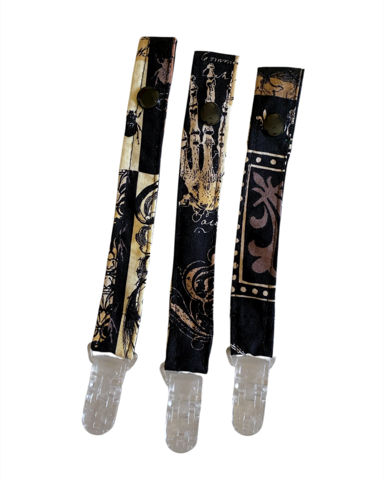 Paci straps with decorative patterns on a white background