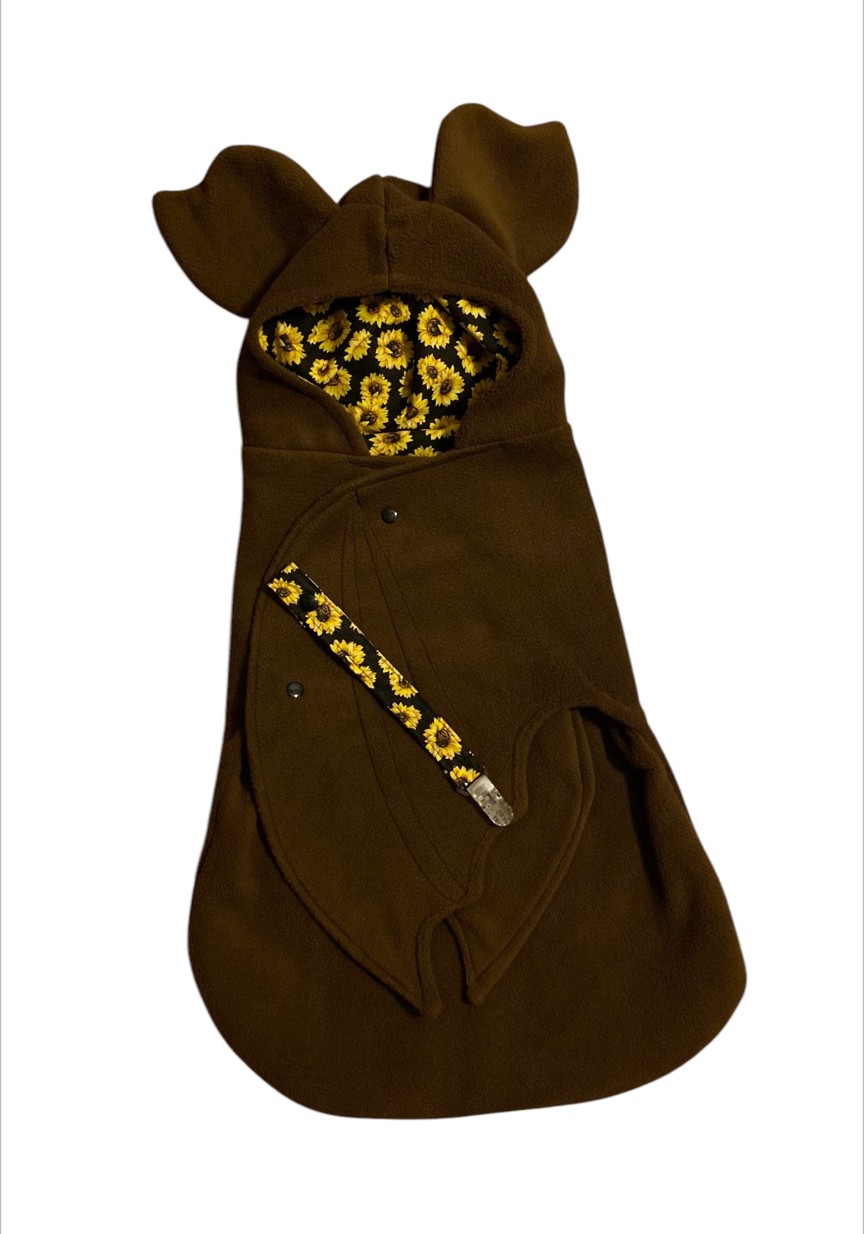 Brown bat-shaped bag with yellow floral patterns on a white background