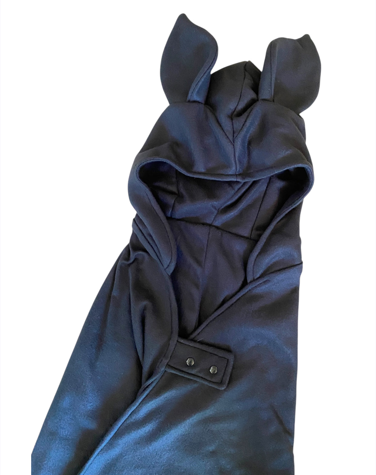Black hooded garment with bat ears on a white background