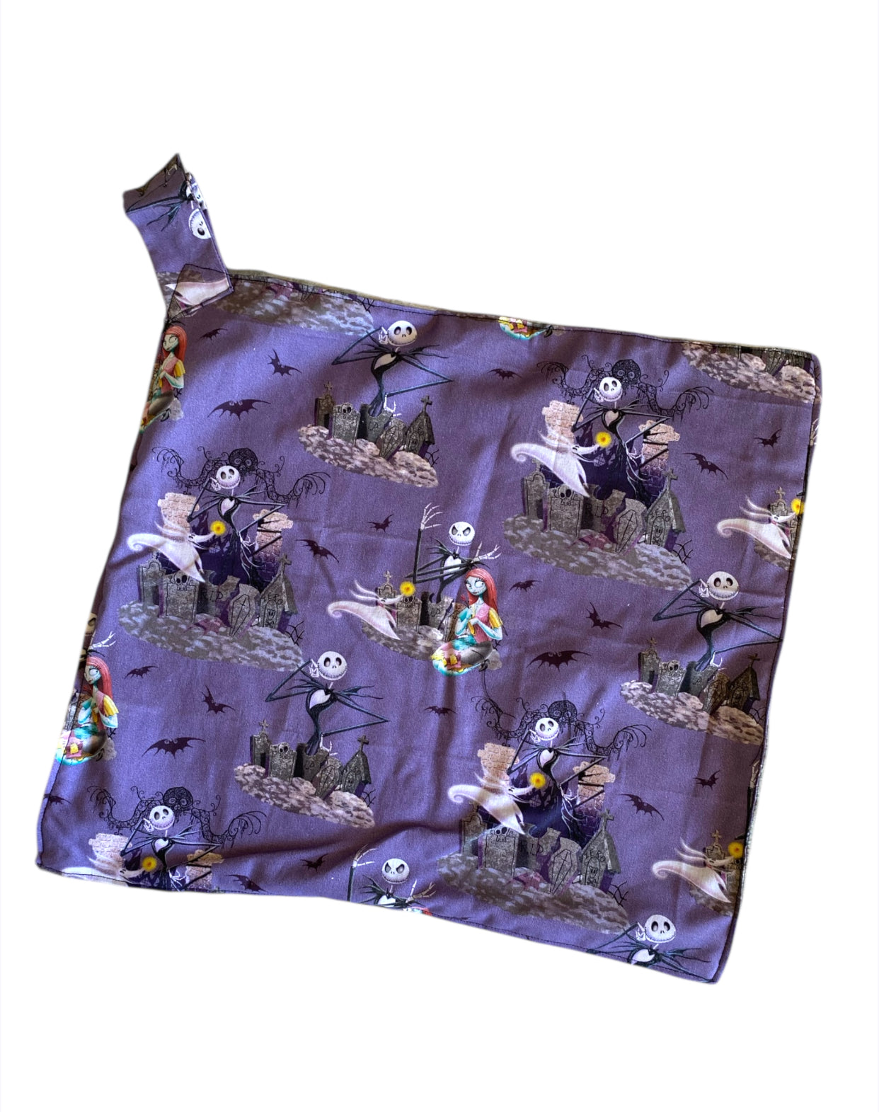 Fabric with 'The Nightmare Before Christmas' character pattern on a white background