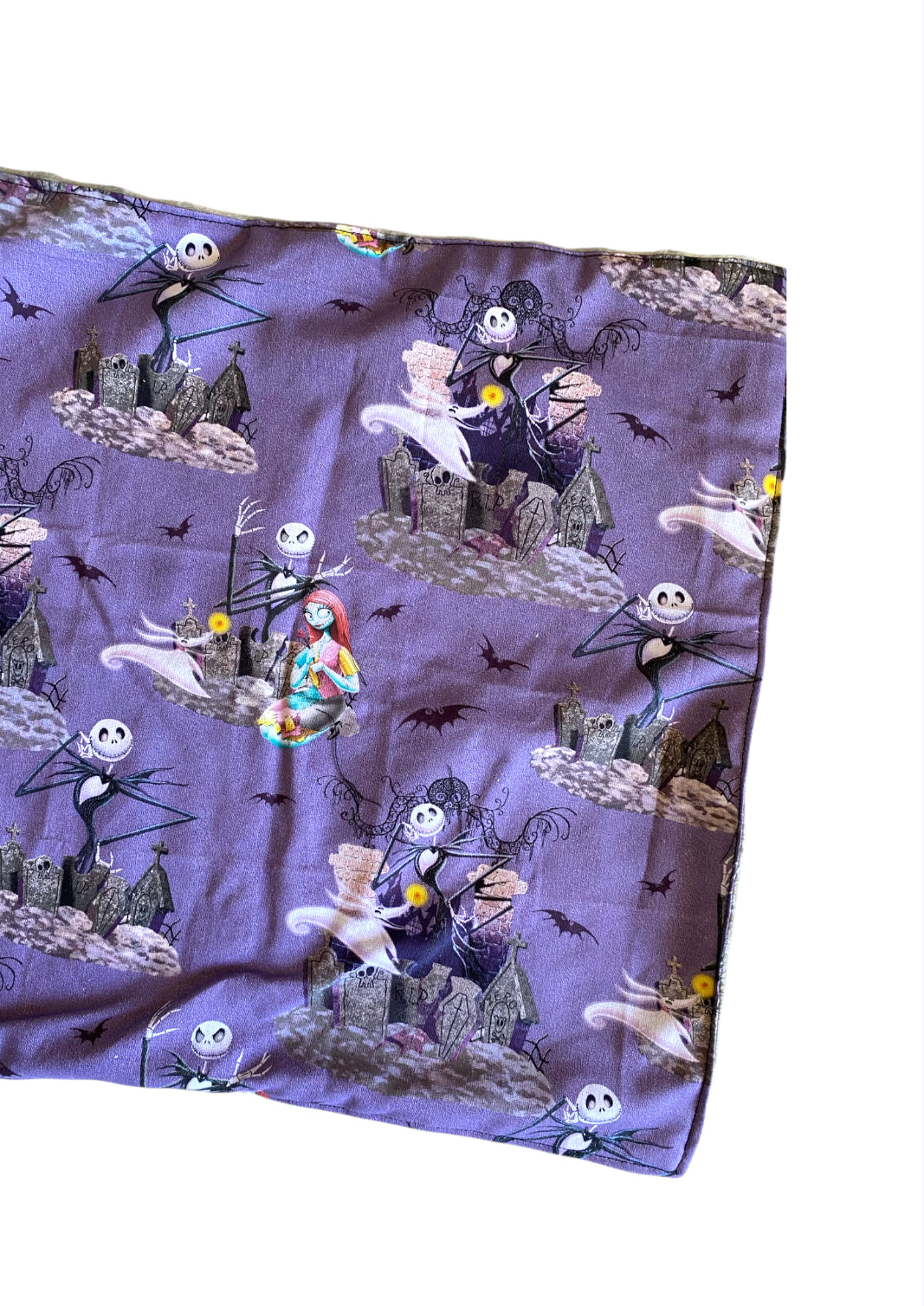 Fleece blanket with 'The Nightmare Before Christmas' pattern on a white background