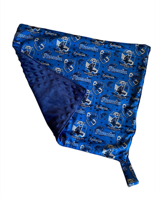 Blue blanket with Ravenclaw design on a white background