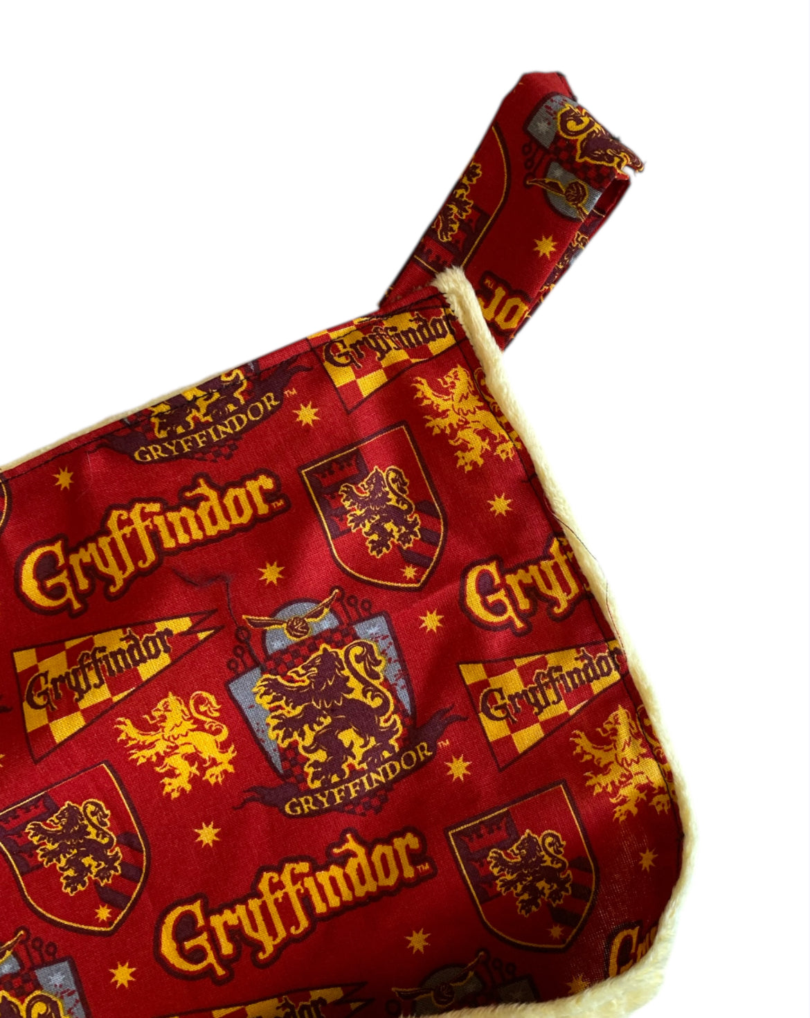 Red fabric with Gryffindor logos and text on a white background