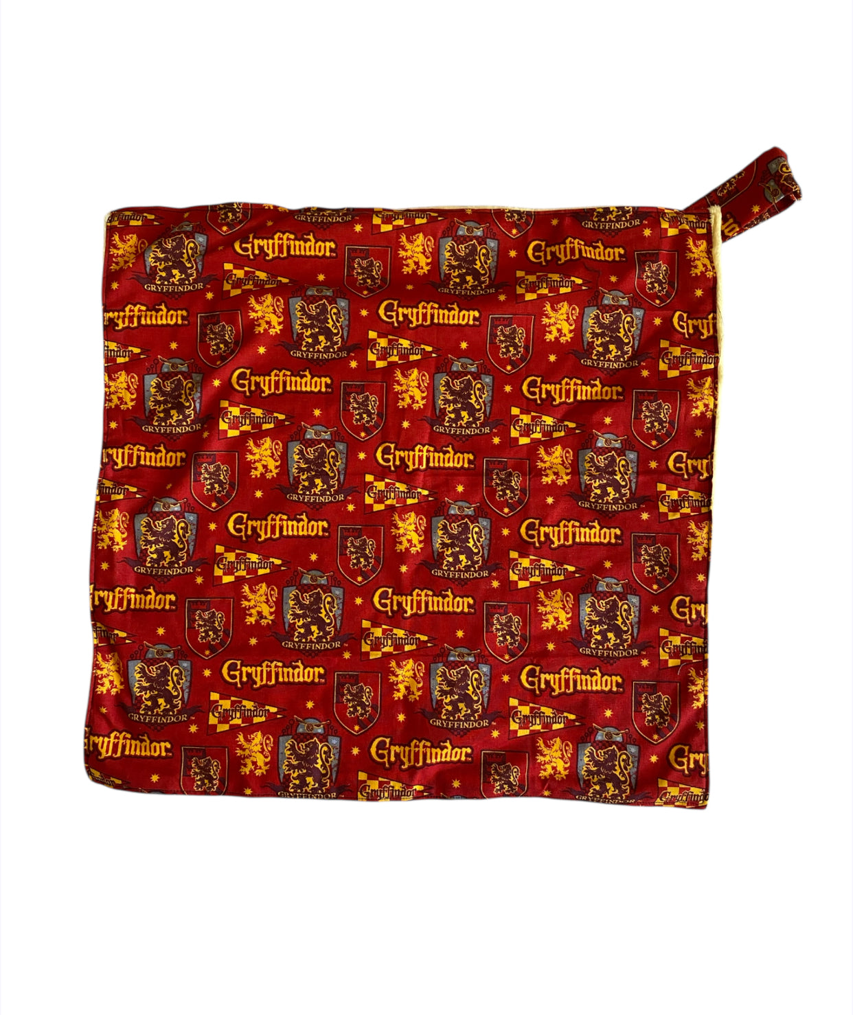blanket with Gryffindor pattern on a red background