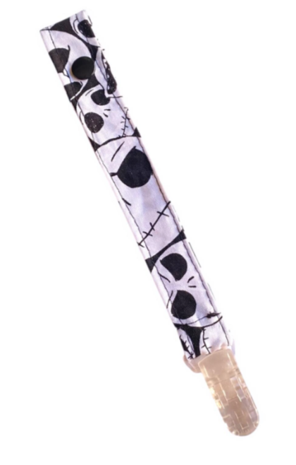 skull pacifier clip for babies on white background