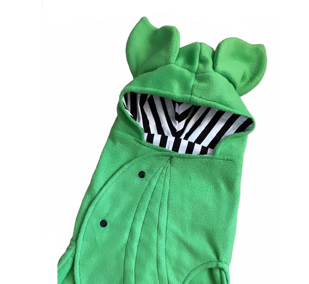 Green animal-themed costume with striped lining on a white background