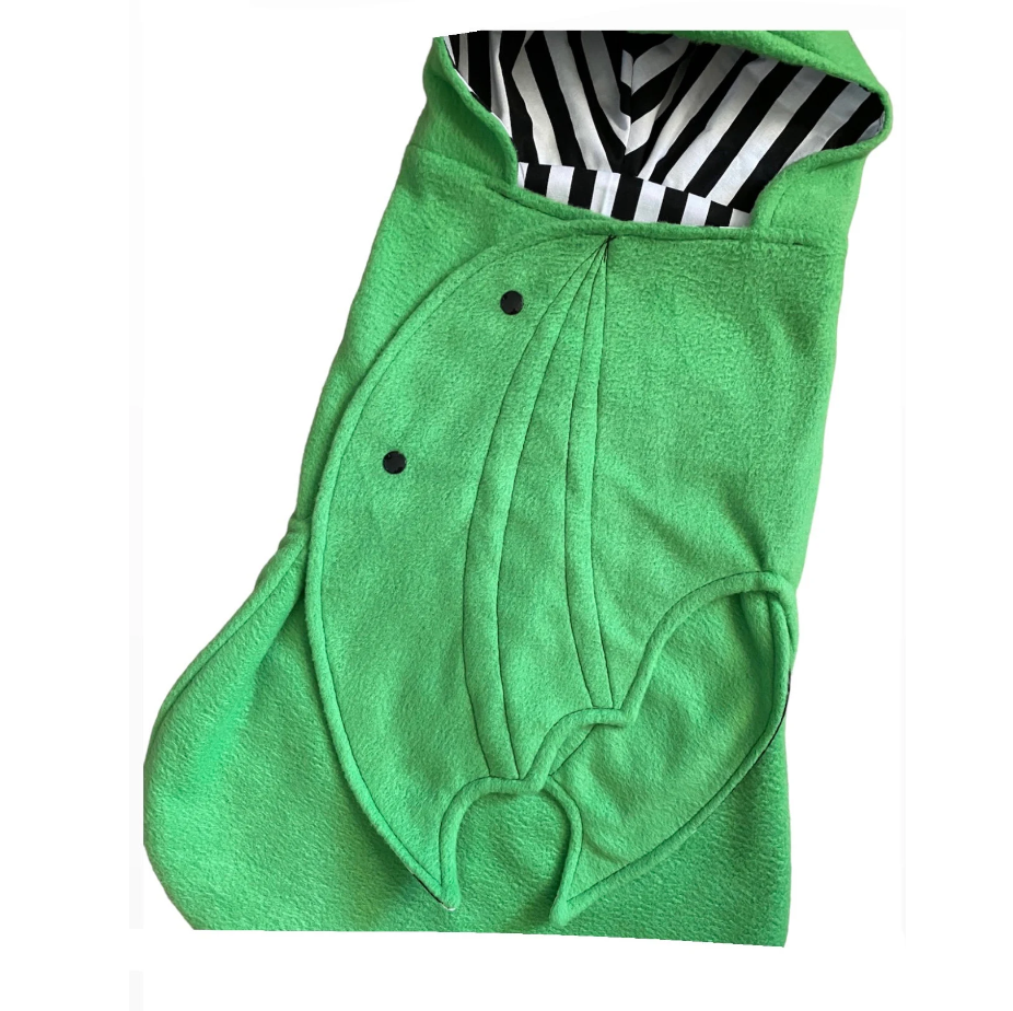 Green animal-shaped hooded towel with black and white interior on a white background