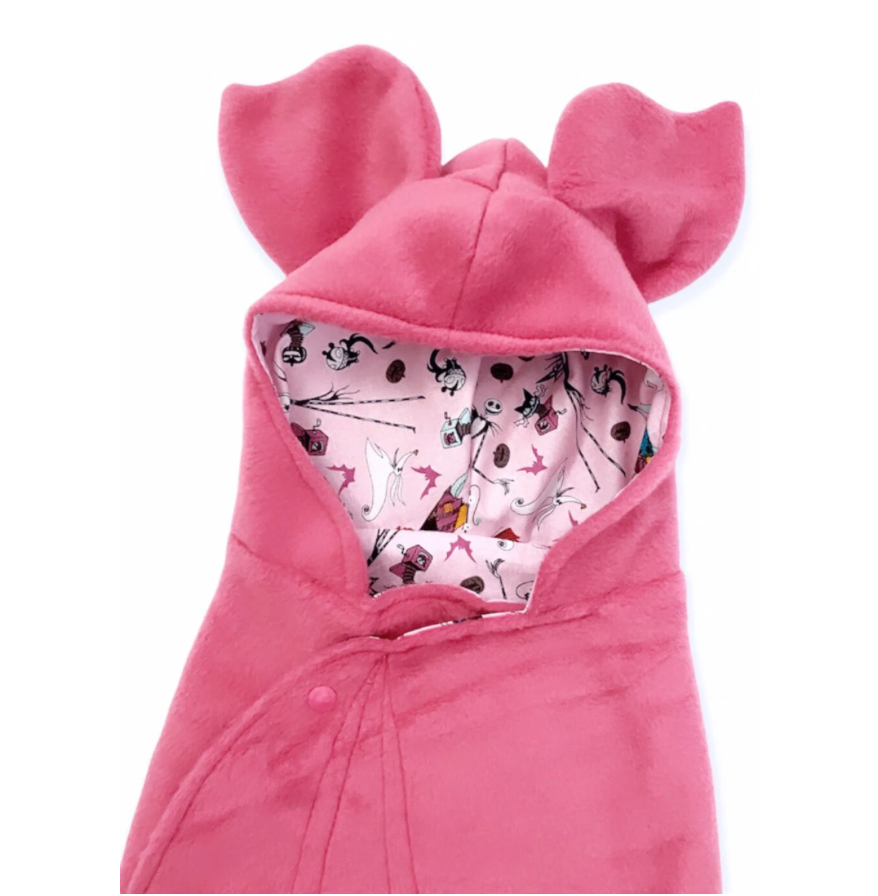 Pink baby bunting with bear ears on a white background