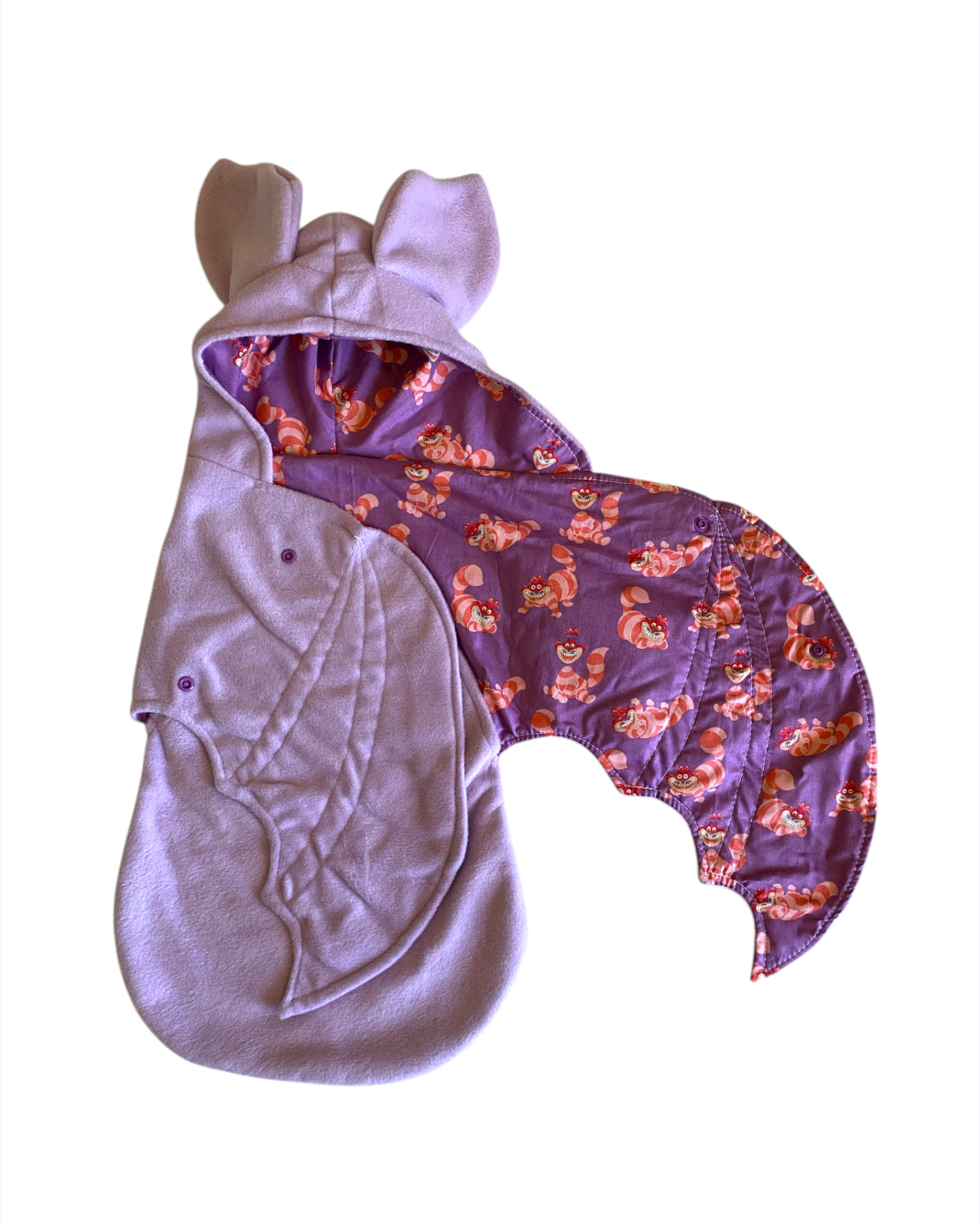 Baby swaddle with purple cat pattern on a white background
