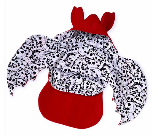 Children's outfit with skull pattern and red on a white background