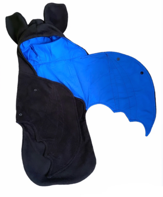 Black and blue baby costume with bat ears on a white background