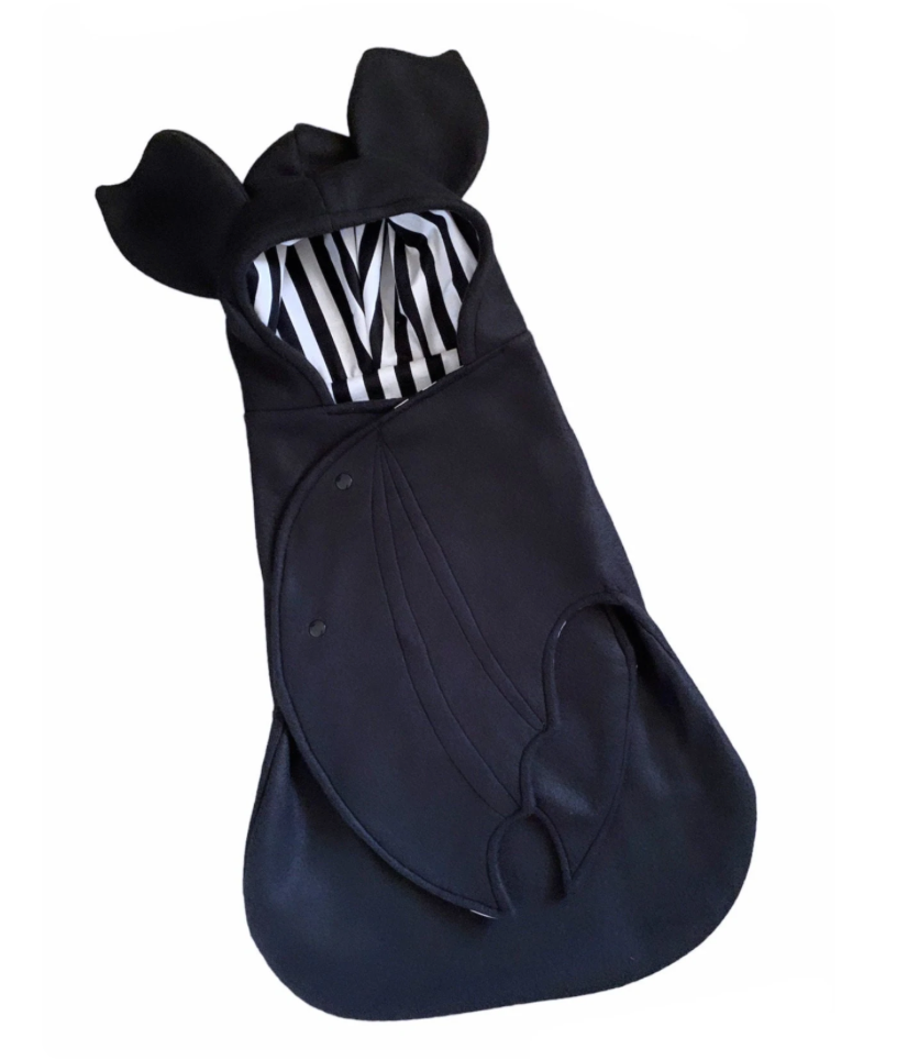 Black baby bunting with zebra pattern hood on a white background