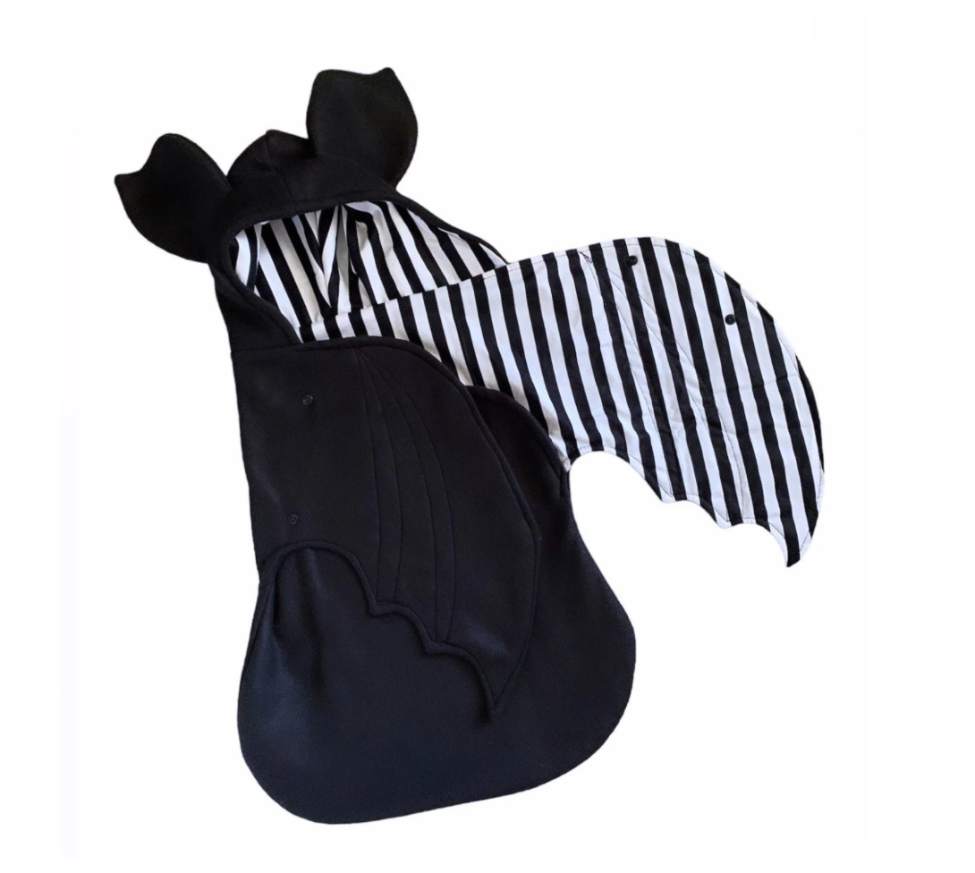 Black and white striped winged costume on a white background