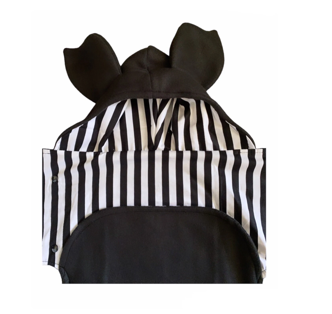 Black and white striped costume with large ears on a white background